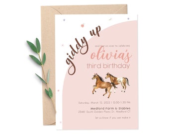 May include: A pink and white birthday invitation with the text "giddy up and trot on over to celebrate olivia's third birthday". The invitation features two watercolour horses, one brown and one brown and white.