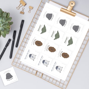 May include: A set of printable Star Wars themed party favor tags. The tags feature various characters from the Star Wars franchise, including Yoda, Darth Vader, Chewbacca, and R2-D2. The tags are printed on white cardstock and have a black and white color scheme.