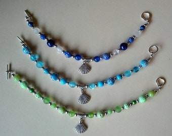 Beaded bracelets with sea shell charms