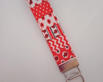Llavero de pulsera con forma de mariquita roja, blanca y negra