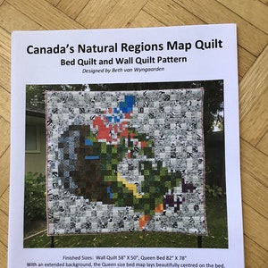 May include: A quilt pattern for a bed or wall quilt featuring a map of Canada's natural regions. The quilt is made of colorful squares and is designed by Beth van Wyngaarden. Finished sizes: Wall Quilt 58" x 50", Queen Bed 82" x 78".