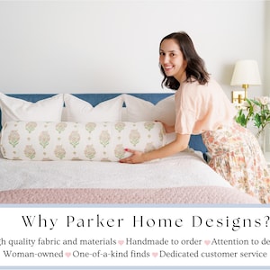 May include: A bedroom scene featuring a bed with a blue headboard, white pillows, and a patterned bolster pillow. The bolster pillow has a floral design in shades of pink and green. The text "Why Parker Home Designs?" is at the bottom.