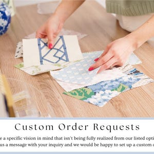 May include: A selection of fabric swatches in various patterns and colors, including blue and white floral, and a cream-colored swatch with a blue geometric design. The image includes the text "Custom Order Requests".