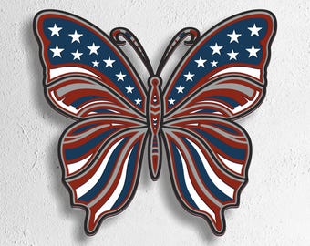 May include: A wooden butterfly cutout with a patriotic design. The wings feature blue sections with white stars and red and white stripes. The butterfly is outlined in black and has a white background. The bottom of the image has the text "SVG - EPS - DWG - DXF - AI".
