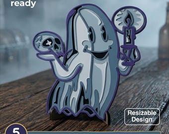 May include: A multi-layered laser cut design featuring a cartoon ghost holding a skull and a lit candle. The text reads laser cut ready, resizable design, 5 layers, SVG, EPS, DWG, DXF, AI. The ghost is rendered in shades of blue, white, and purple.