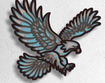 May include: A layered wooden eagle in flight, in shades of blue, brown, and tan. The artwork is set against a white background. The bottom of the image includes the text "SVG - EPS - DWG - DXF - AI".