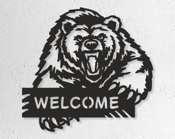 May include: Black metal bear silhouette with an open mouth and the word "WELCOME" on a rectangular sign. The bear has a fierce expression. The bottom of the image shows the text "SVG - EPS - DWG - DXF - AI".