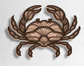 May include: A layered, three-dimensional crab design in shades of brown and tan, with detailed claw and leg structures. The crab is set against a textured white background. The bottom of the image displays the text: SVG - EPS - DWG - DXF - AI.