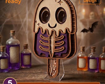 May include: A multi-layered wooden popsicle-shaped wall art piece featuring a ghost design with a skeleton ribcage cutout, five distinct layers, and a natural wood finish. The design includes text reading laser cut ready, Resizable Design, and 5 LAYERS SVG - EPS - DWG - DXF - AI.