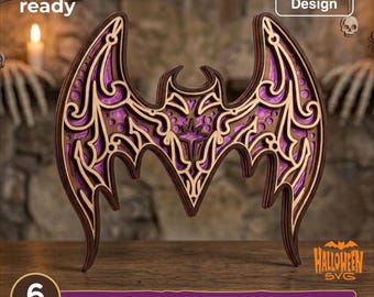 May include: A multi-layered laser cut wood bat design featuring intricate scrollwork and purple accents. The digital file includes text labels for laser cut ready, resizable design, 6 layers, and file formats SVG, EPS, DWG, DXF, and AI.