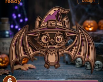 May include: A multi-layered laser cut design of a bat wearing a purple witch hat. The bat features brown and tan tones with large eyes and spread wings. Text on the image reads laser cut ready, Resizable Design, and 6 LAYERS SVG - EPS - DWG - DXF - AI.