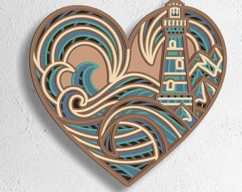 May include: A heart-shaped wooden artwork with a lighthouse and ocean waves design. The piece uses brown, blue, and beige tones. The bottom of the image shows the text "SVG - EPS - DWG - DXF - AI".