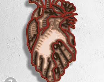 May include: A layered wooden heart sculpture with a red outline and various shades of brown and beige. The design shows the internal structure of a heart. The image includes the text "7 layers" and file type options: SVG, EPS, DWG, DXF, and AI.