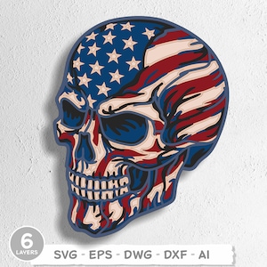 May include: A layered wooden skull design featuring the American flag. The skull is colored with red, white, and blue, with the stars and stripes of the flag incorporated into the design. The image includes the text "6 LAYERS" and file type options.