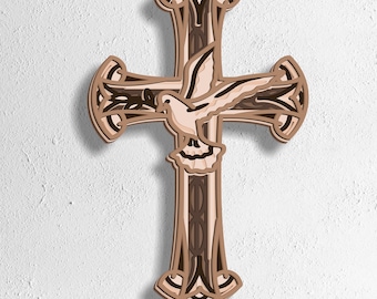May include: A layered wooden cross featuring a dove in flight. The cross is in shades of brown and beige, with detailed cut-out patterns. The dove is light beige. The bottom of the image has the text: SVG - EPS - DWG - DXF - AI.
