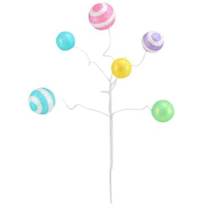May include: A white twig with five colorful balls. The balls are pink and white striped, light blue, yellow, purple and white striped, and light green.