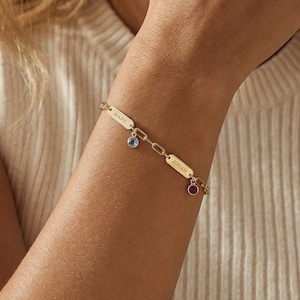 May include: A set of three ceramic mugs with a speckled, matte finish. The mugs are in shades of cream, light gray, and dark gray. Each mug has a simple, minimalist design and a rounded handle.