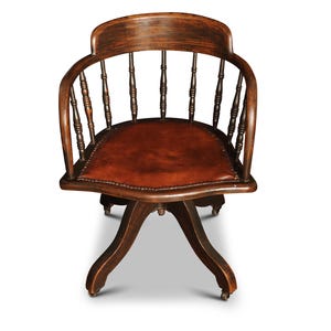 1900&#39;s American Oak Spindle-Backed Bow Arm Revolving Office Chair With Brown Leather Upholstered Brass Studded Detailing
