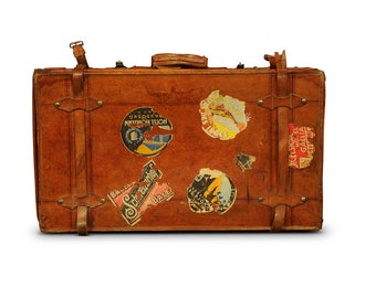 Brown leather suitcase with well travelled labels British made circa 1920's