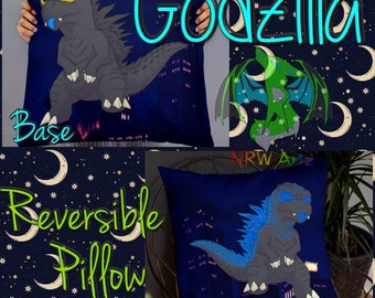 May include: Reversible Godzilla pillow with a cartoon illustration of Godzilla in gray and blue. The pillow has a dark blue background with a cityscape and the word "Godzilla" in turquoise.