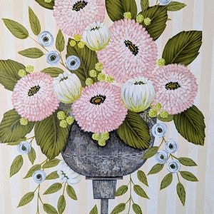 May include: An original painting of a floral arrangement in a gray urn. The arrangement features pink, white, and blue flowers with green leaves. The background has vertical beige and white stripes. The painting is signed in the bottom right corner.