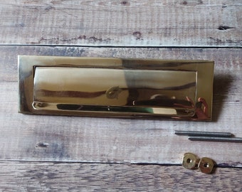 Polished brass reclaimed door mail slot