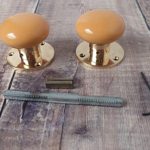 1 Pair Of Ceramic & Brass Door Knobs
