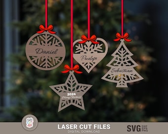 May include: Four laser cut wooden Christmas decorations with snowflake designs. The decorations are a round bauble, a heart, a Christmas tree, and a star. Each decoration has a name on it: Daniel, Penelope, Sebastian, and 2024 Merry Christmas.
