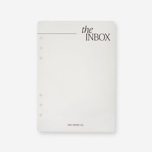 Könnte beinhalten: Weißes Blatt Papier mit einer schwarzen Linie und dem Text "the INBOX" oben. Am unteren Rand des Blattes steht der Text "MAY PAPER CO."