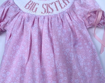 A beautiful heirloom smocked big sister toddler dress. This dress is so special that the sleeves are smocked.