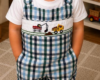The long all is made from classic plaid fabric with shades of soft blue, navy, green, and white,