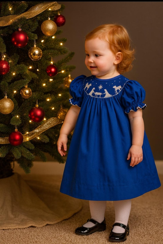Brilliant blue Nativity Dress. bishop style neckline with hand smock Nativity in White