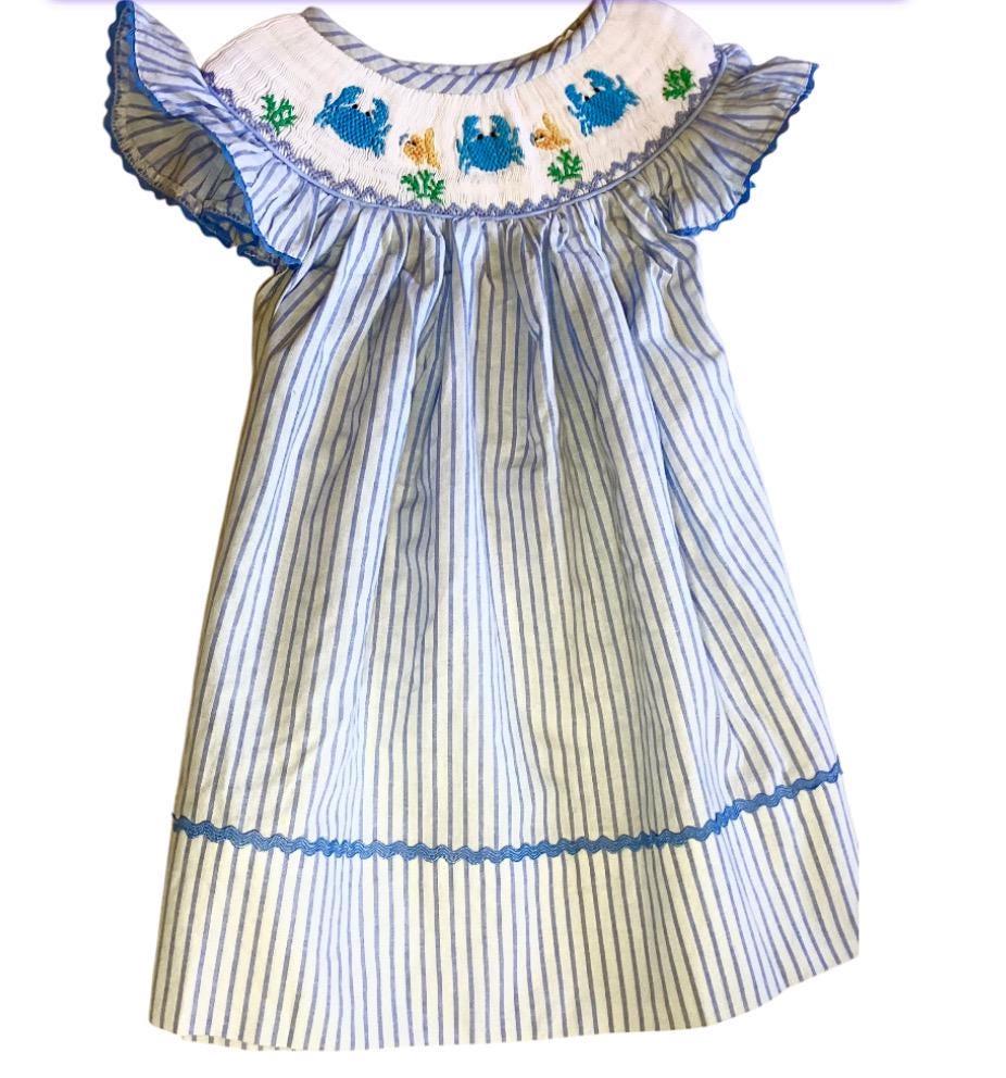 Charming hand smocked blue dress bishop neckline, beautifully adorned with playful crabs and fish and designed with lovely butterfly sleeves
