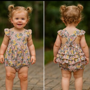 Ruffles, ruffles and more ruffles. Cute yellow lemon and pink flowers pattern bubble romper with ruffles trimmed in Rick rack