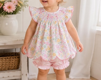 Pink and yellow floral smock short set. Beautifully smocked bodice with roses and scalloped top. Matching pink shorts.