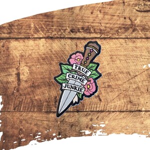 May include: A handmade wooden sign with the text "Welcome to our home" in a handwritten style. The sign is painted white with black lettering and a distressed finish, perfect for home decor.