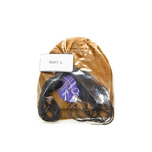 May include: A brown leather kit for making leather sandals, with black laces and a label that says "Men's L".