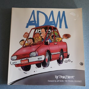 May include: A red car with a license plate that reads "OH DAD" is filled with passengers. The car is driving on a road with a soccer ball in the background. The book cover is titled "ADAM" and is by Brian Basset.