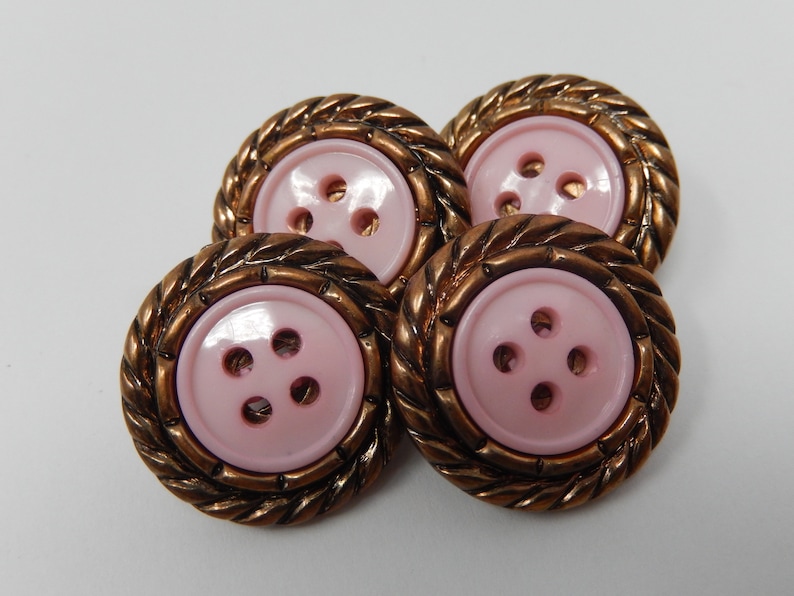 Four pink buttons circled diameter 2.2 cm