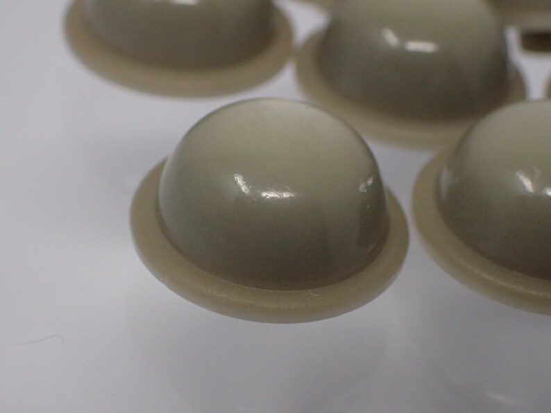 seven vintage hat buttons