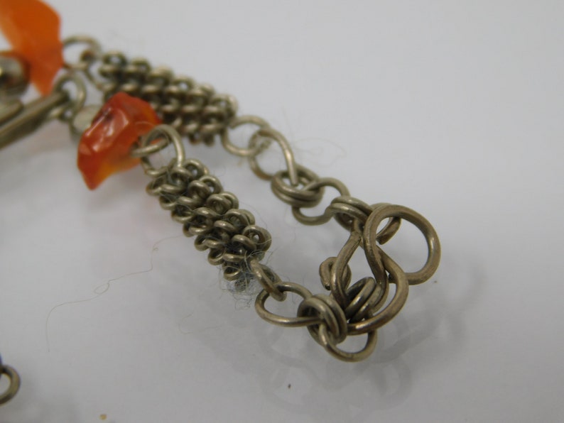 silver metal bracelet with agate sprig