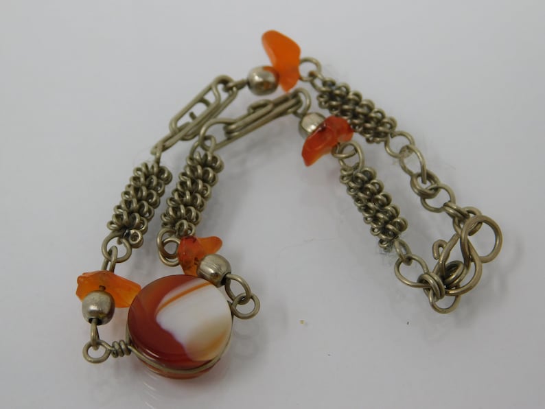 silver metal bracelet with agate sprig