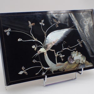 vintage mother-of-pearl sculpture under glass