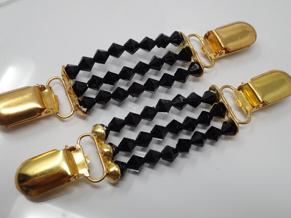 pair of pliers, suspenders