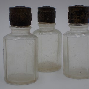 three old perfume bottles