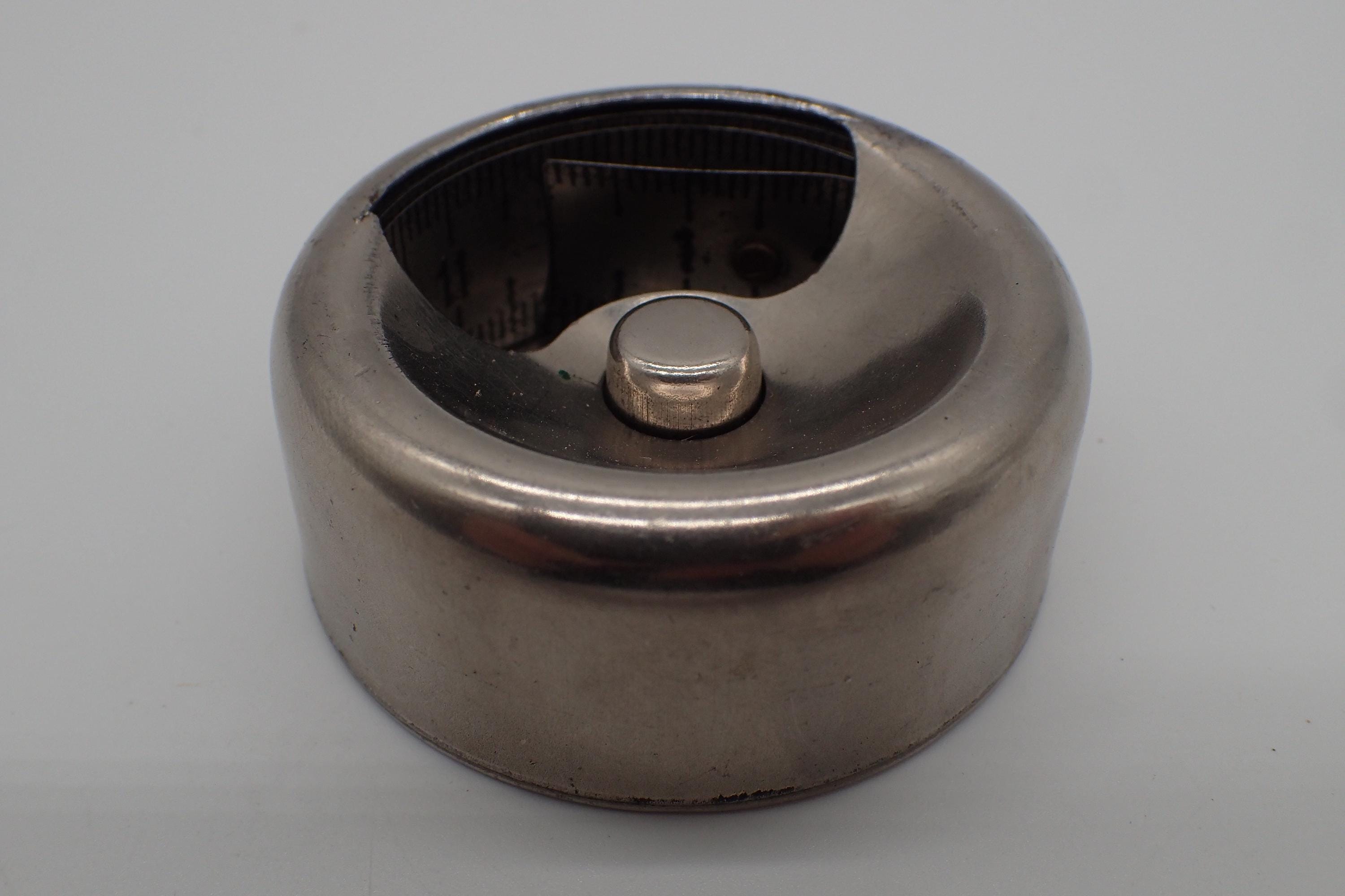 vintage metal tape measure