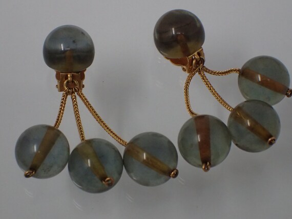 earring with blue spheres
