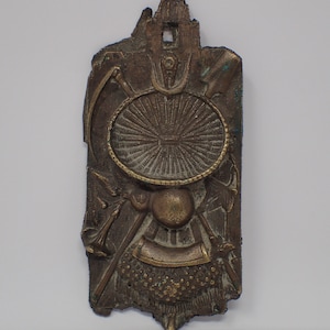 bronze wall sculpture