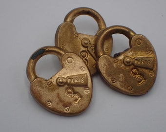 three vintage copper padlock buttons