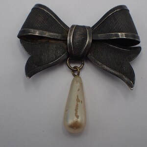cabochon vintage noeud argenté avec perle
